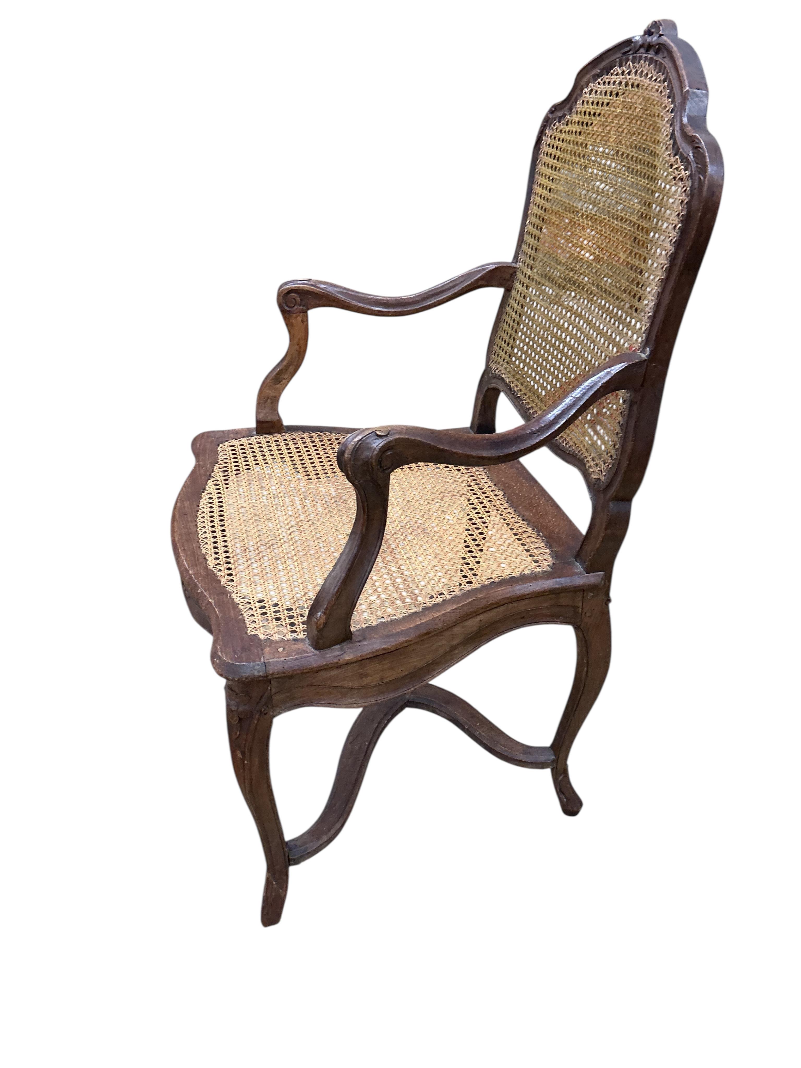 A 19th century French caned beech elbow chair, width 60cm, depth 48cm, height 90cm